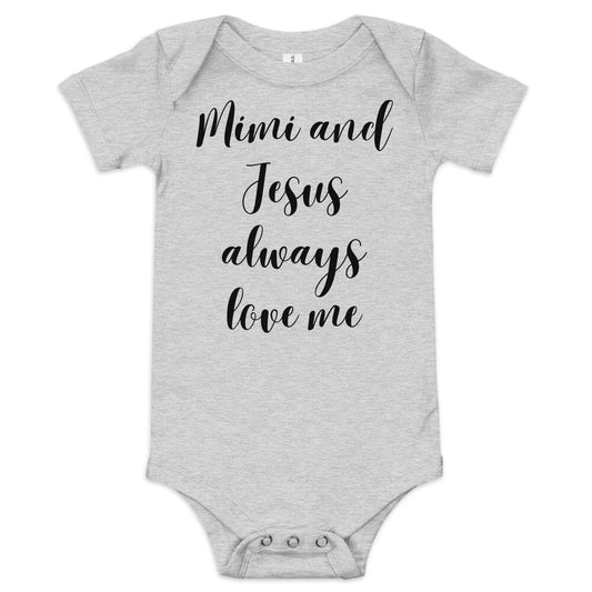 A light gray short-sleeved baby onesie with three snaps at the bottom for closure and black text on the front in script that reads:  Mimi and Jesus always love me.