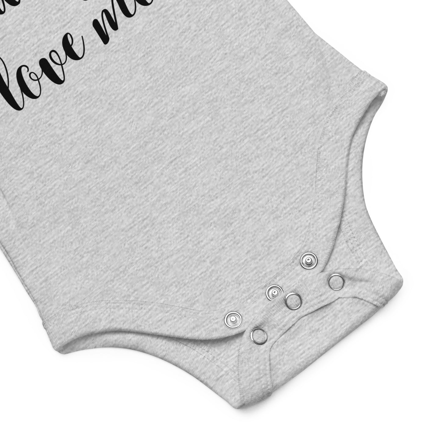 Photo shows the lower part of a light gray onesie to show the three-snap closure at the bottom.