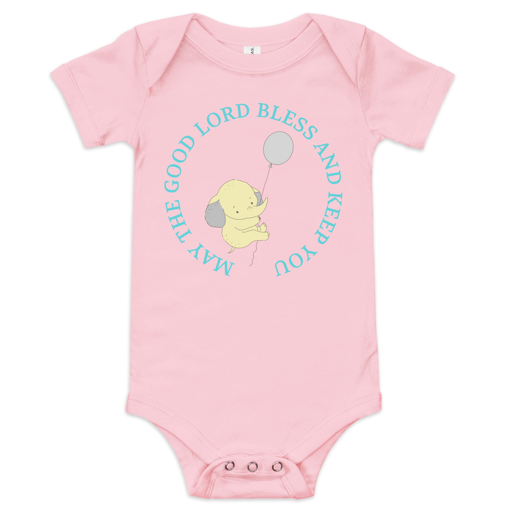 A pink short-sleeved onesie with snaps at the crotch is laying on a white background. In the center, in a circle, aqua letters say: May the Good Lord Bless and Keep You" and in the middle of that is a yellow elephant holding a balloon and they are floating up in the air.