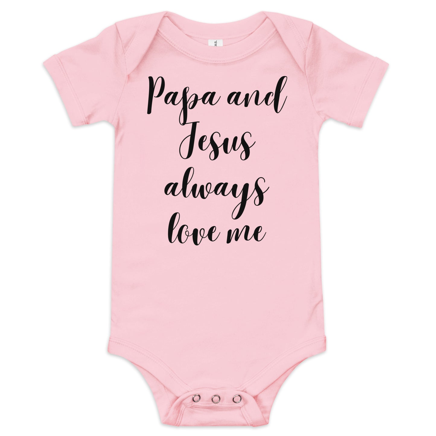 A white background showcases a light pink short-sleeved onesie with a three-snap closure at the bottom and black cursive words on the front that read:  Papa and Jesus always love me.