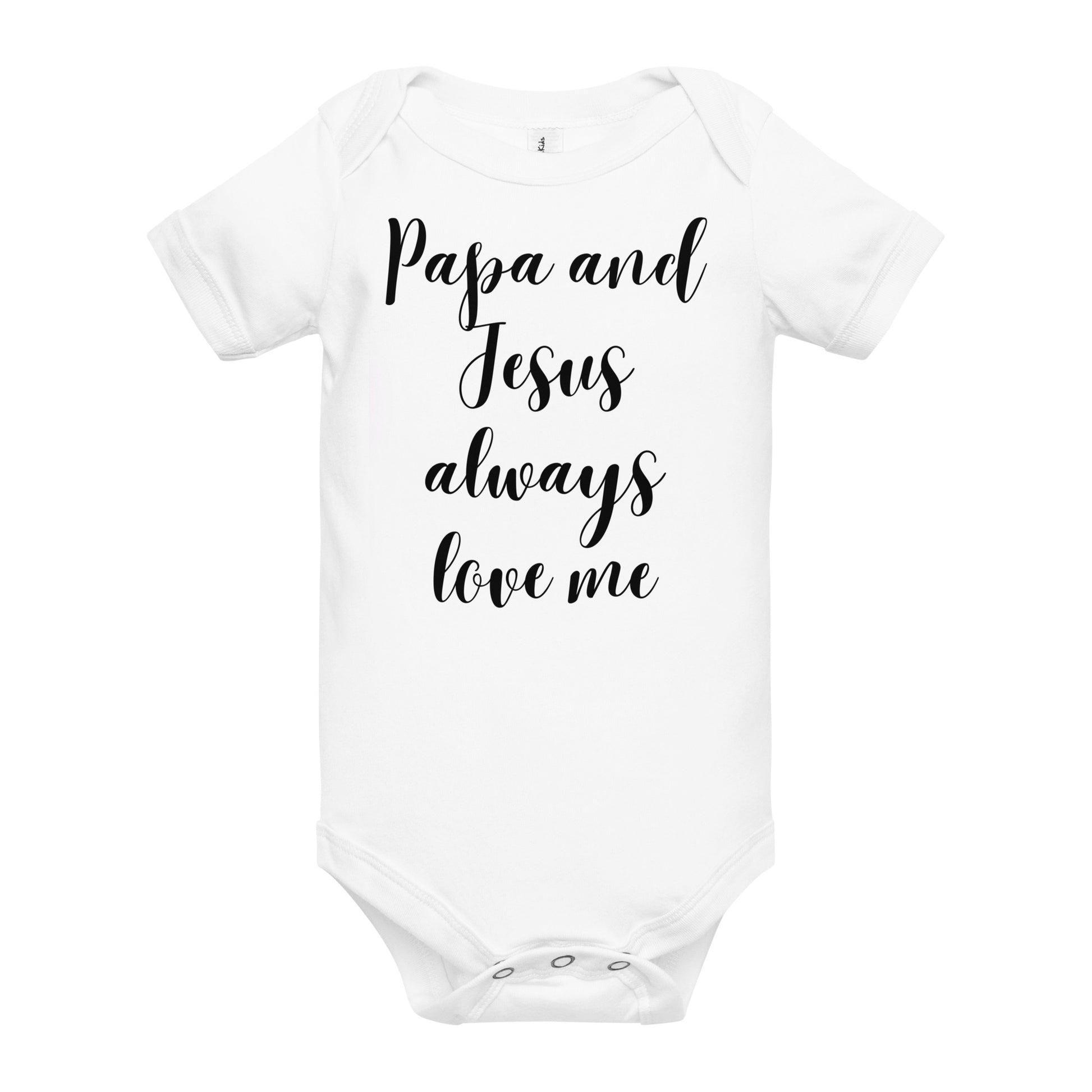 The front of a white one piece baby body suit or onesie is displayed on an all white background. The short-sleeved white ones has black lettering on the front in ornate cursive and says "Papa and Jesus always love me."