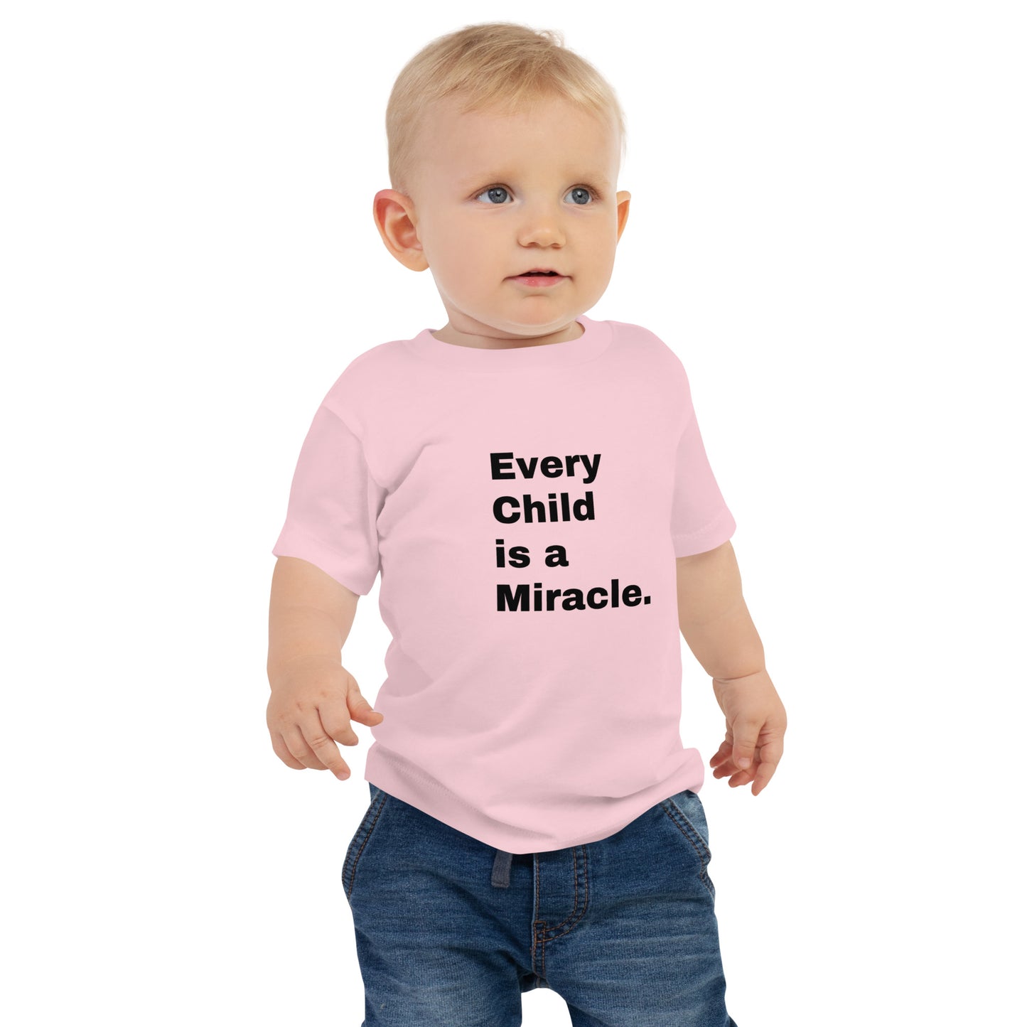 Pink short-sleeved t-shirt that says Every Child is a Miracle in black on the front, worn by a blonde toddler on a white background.