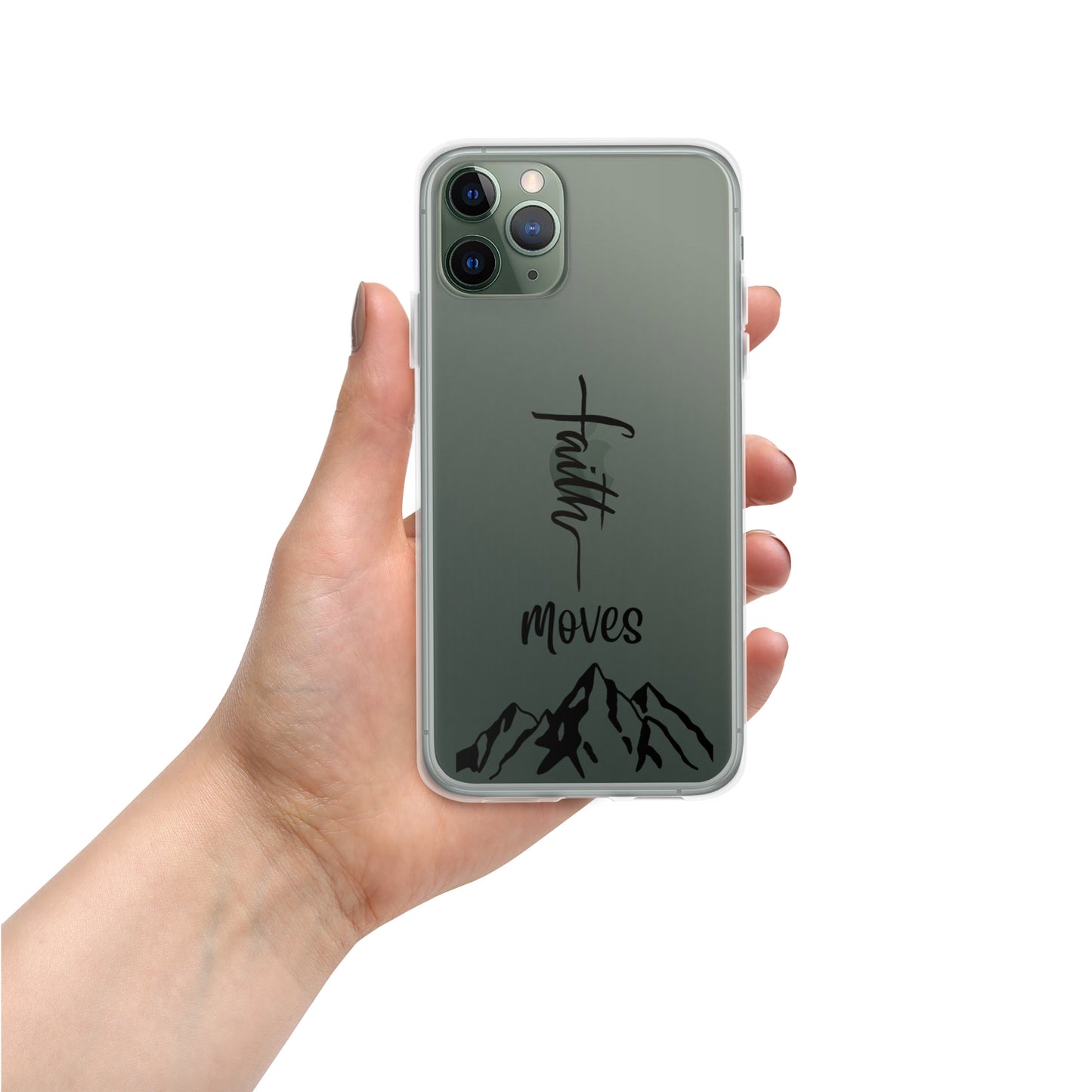 A manicured woman's hand holds a silver or green or gray iphone with a clear case over it  that says faith moves and a picture of a mountain.