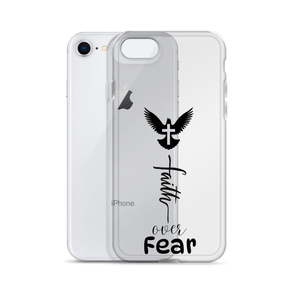 White iphone with a clear cell phone case halfway on it that says faith over fear in three different fonts with a graphic of a dove with a cross on it over the words.