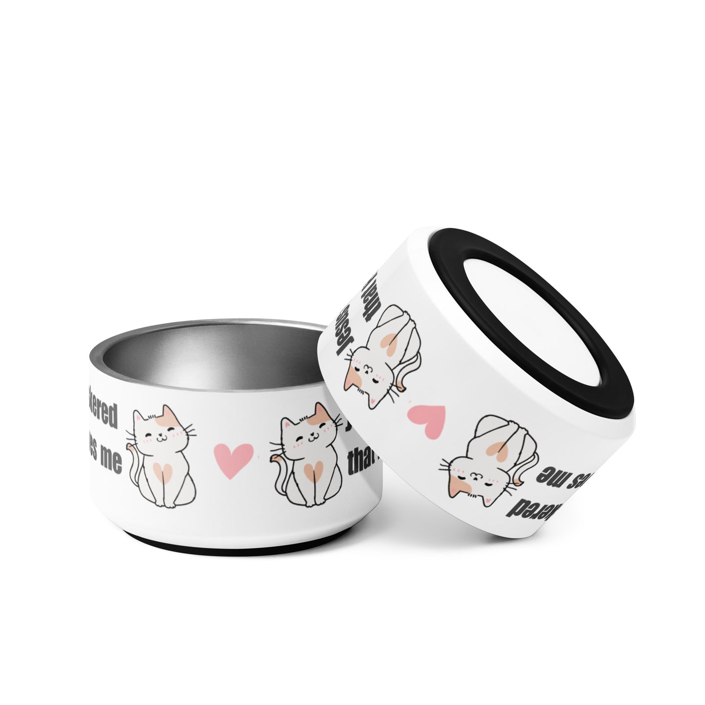 Two stainless steel cat dishes, identical on a white background, but one dish is turned upside down and resting on the first to show the black rubber bottom on the pet bowl. There are words and a design with cat graphics and a pink heart on the side of the dish on a white background.