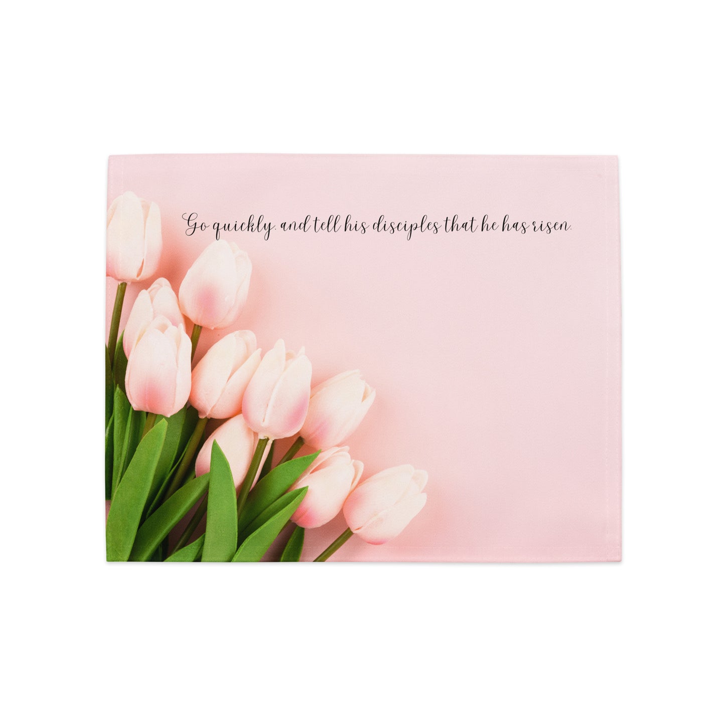 Light pink fabric placemat with light pink tulips on it and Easter scripture.