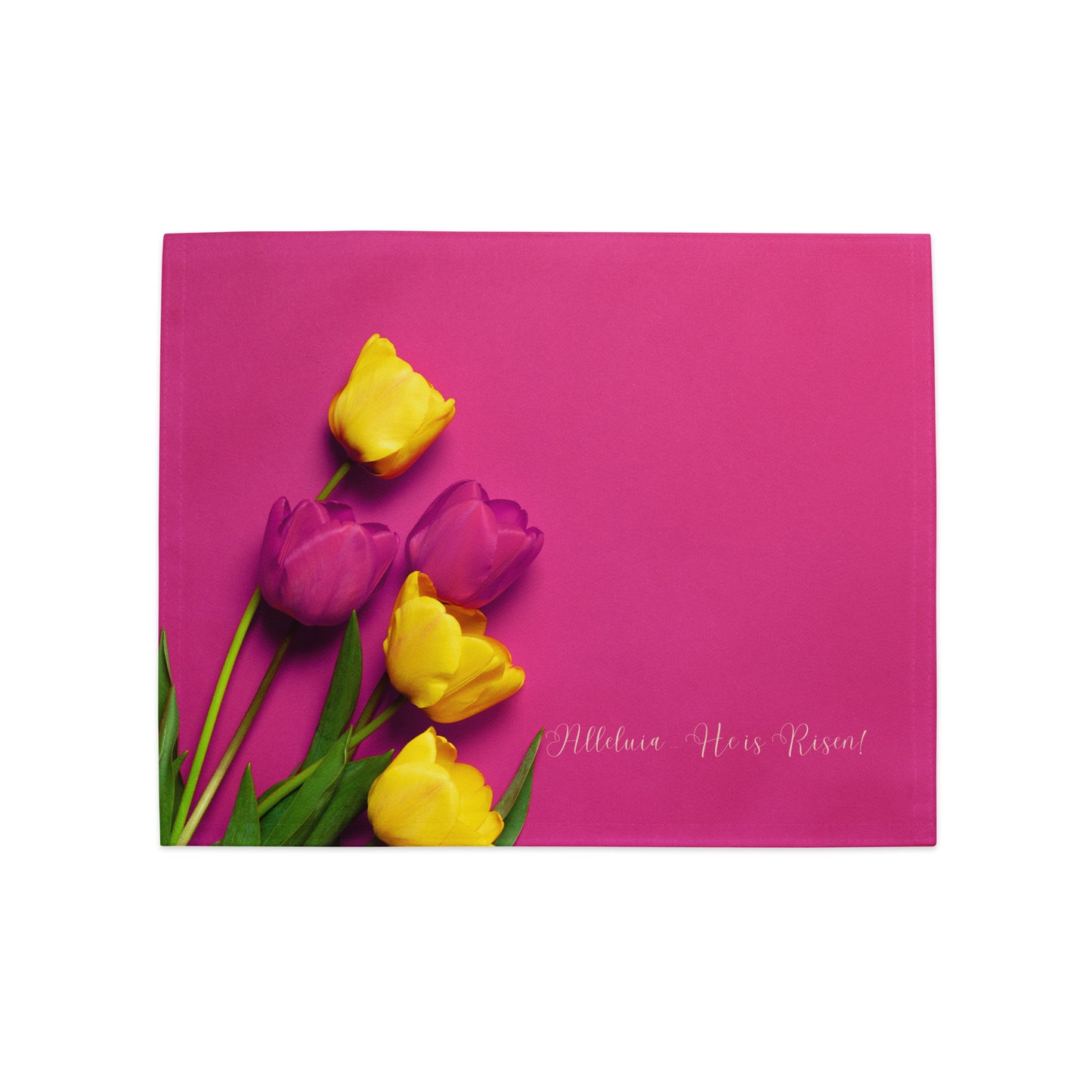 Deep pink fabric placemat with deep pink and bright yellow tulips on it that says Alleluia He is Risen.