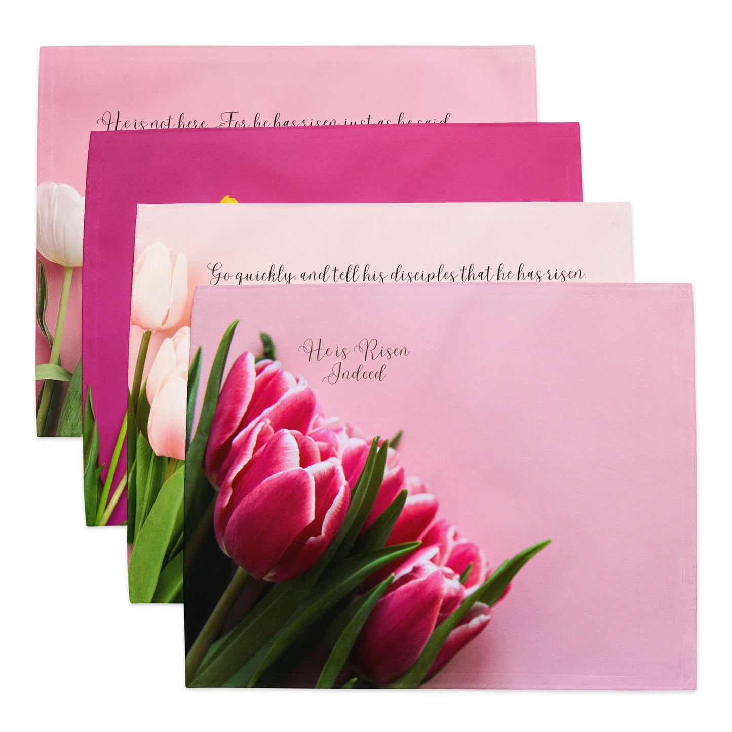 Four pink fabric placemats, layered to see some of each one, with tulips and words on them.