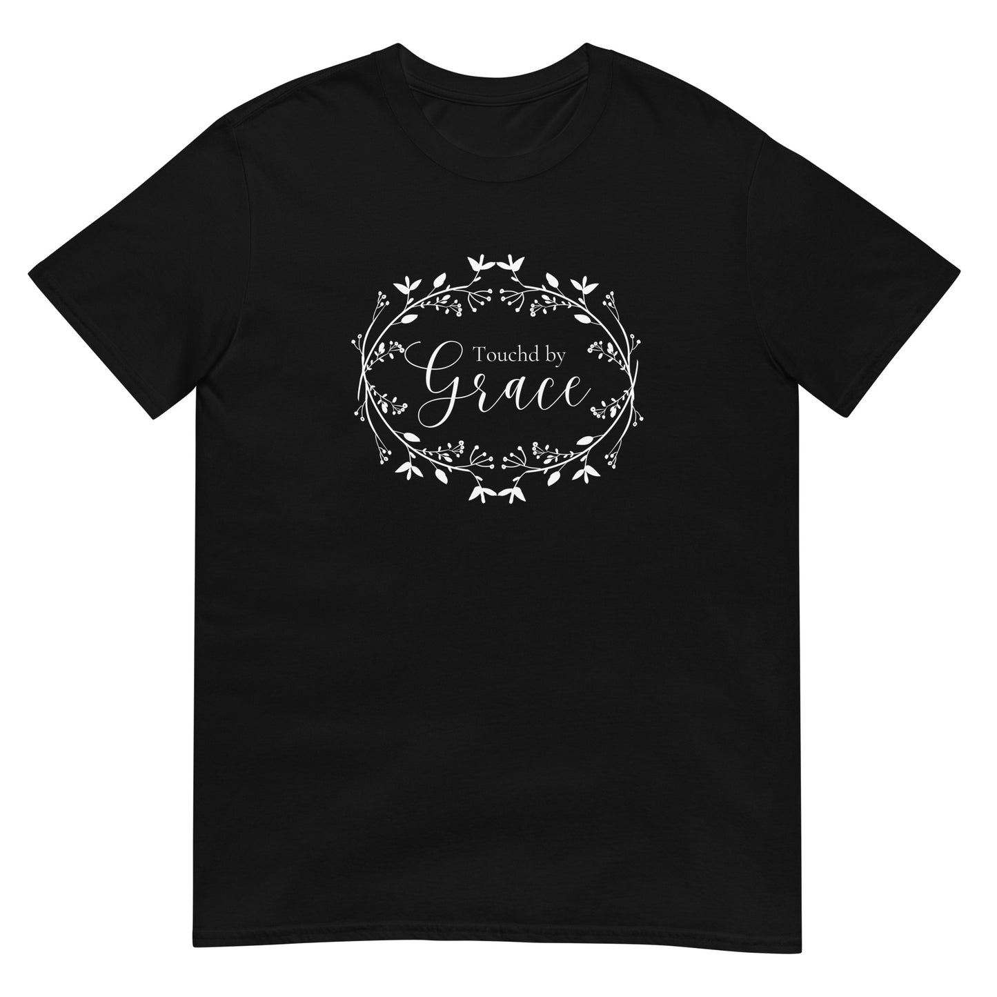 A black short-sleeved t-shirt shown laying flat and it is decorated in the center with a white floral wreath kind of design with the words Touched by in one font and in a larger more ornate font the word Grace so that it reads Touched by Grace.