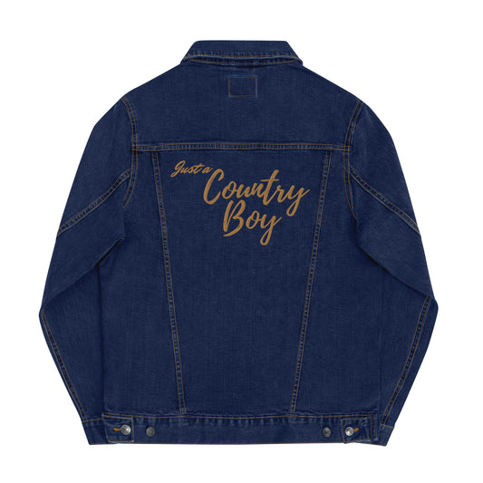 Back view of a blue denim jean jacket that is embroidered with gold thread that says Just a Country Boy.