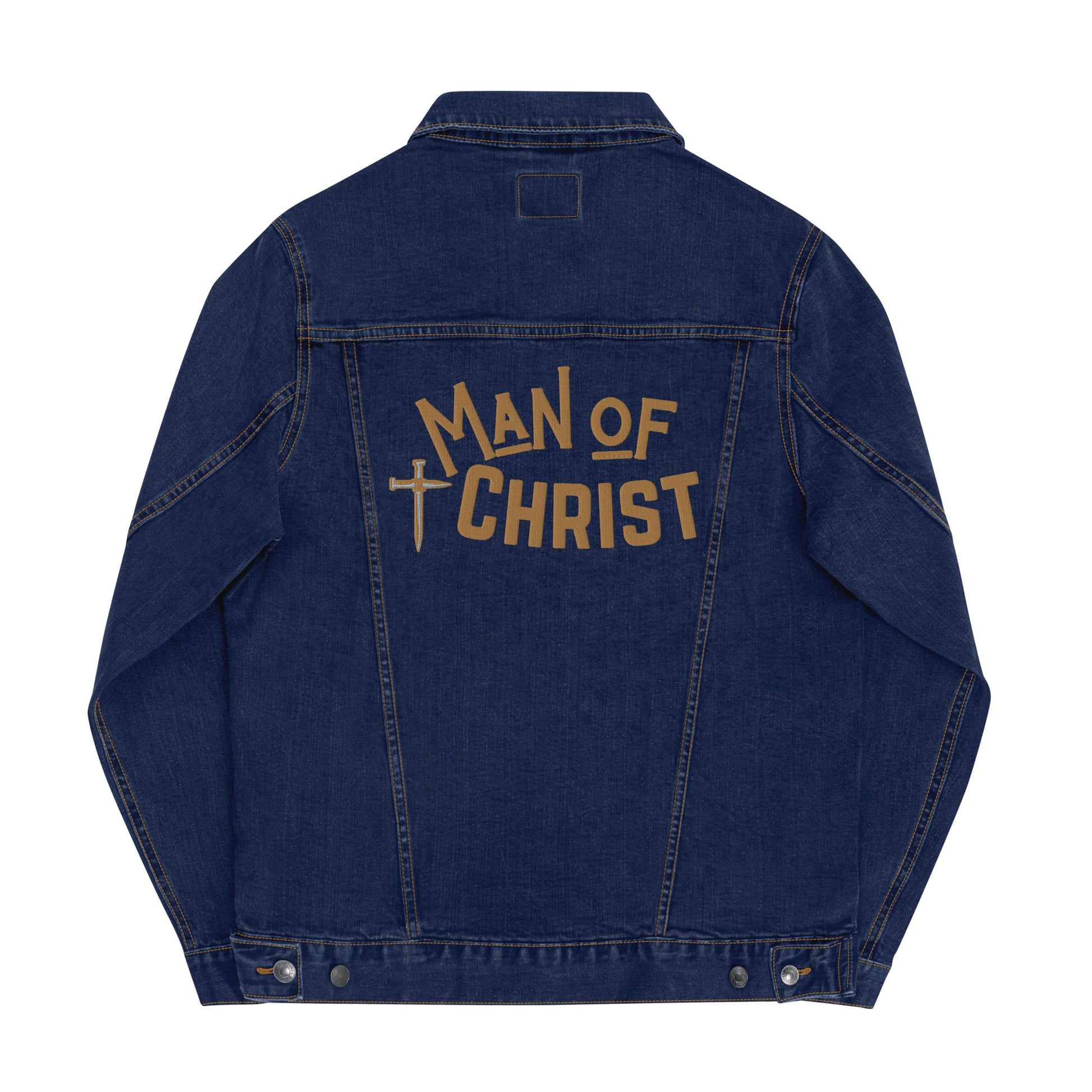 A classic blue denim jean jacket, back view showing bold gold embroidered lettering that says MAN OF CHRIST and a cross made of nails embroidered with gold and gray thread.