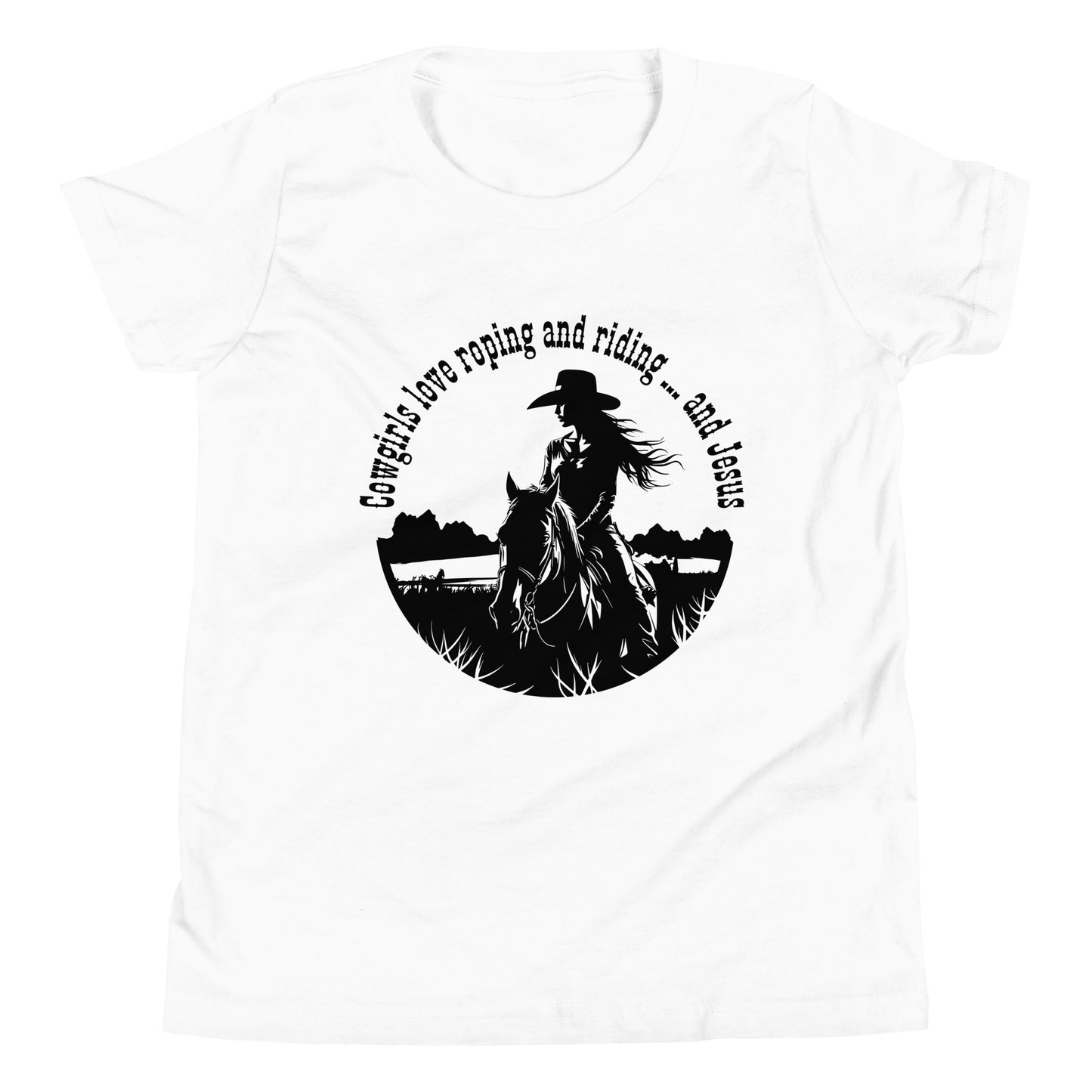 White short-sleeved t-shirt on a bright white background and in the center is a circular design in black that says Cowgirls love roping and riding ... and Jesus with a cowgirl riding a horse.